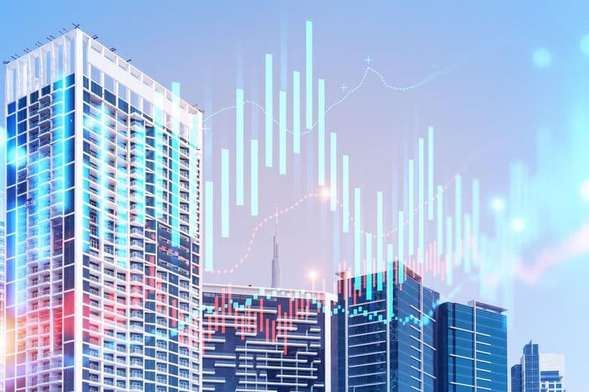 Budovy s Burj Khalifa na pozadí a grafy v popredí.